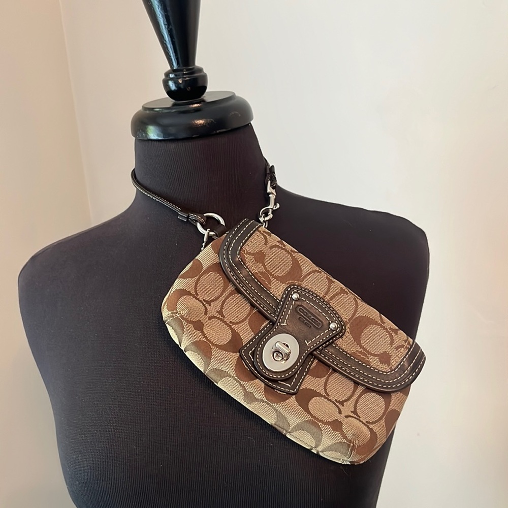 Signature canvas coach wristband bag.